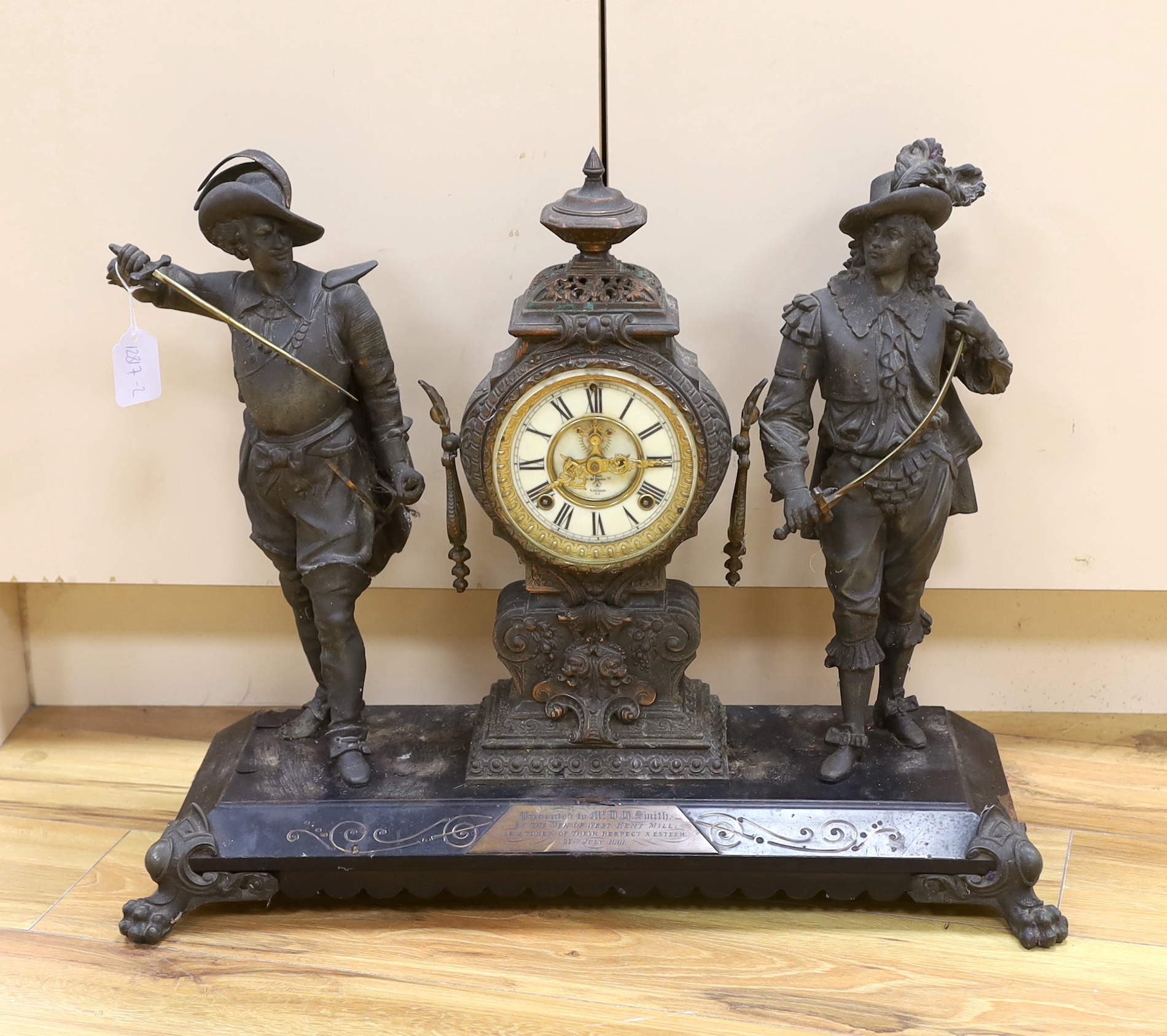 A 20th century American spelter and Cavalier figural mantel clock, 52cm high